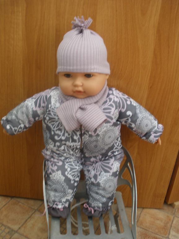 И куколку приодели