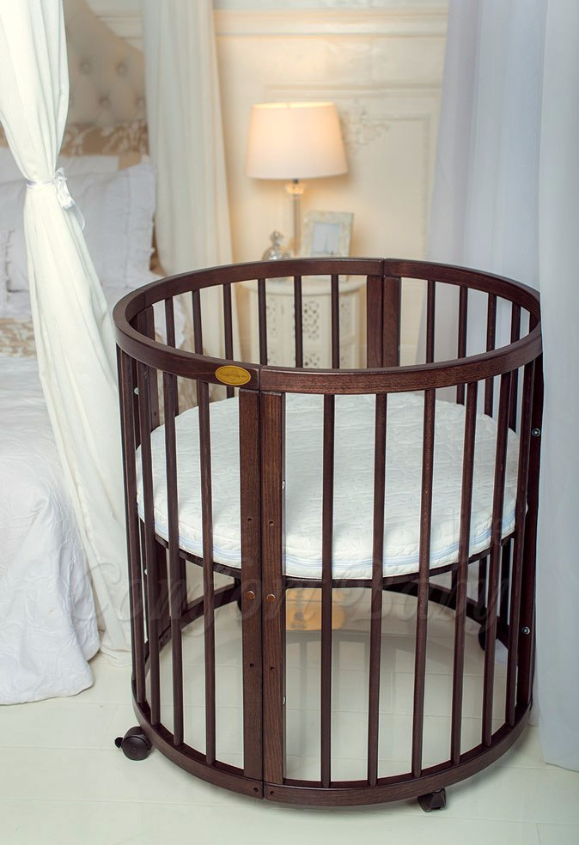 КРОВАТКА- ТРАНСФОРМЕР "COMFORT BABY" .Цена: 25 000 руб.  ХАРАКТЕРИСТИКИ:  возраст детей: 0-5 лет  габариты модели (Д х Ш х В): 1) колыбельки: 78*76*81 см  2) овальной кроватки: 128*76*81 cм  матрас приобретается отдельно.  максимальная нагрузка: 120 кг  Материал: изготавливается только из настоящего массива бука высшего сорта.  сборка: кровать в разобранном виде, простота сборки, инструкция по сборке на русском языке  продукция сертифицирована  производство: Россия  гарантия: 2 года   Дополнительные характеристики: 4 положения по высоте (расстояние положения дна от пола без колес: 1см, 12см, 37см, 57см; расстояние между отверстиями снизу-наверх: 12см, 15см, 20см.); 3 прутика - съемные.  КОНМПЛЕКТАЦИЯ:  1-я ступень - круглая кроватка  2-я ступень - овальная кроватка  3-я ступень - диванчик  4-я ступень - манеж  5-я и 6-я ступени - 2 кресла и столик  7-я ступень - пеленальный столик  ДОПОЛНИТЕЛЬНЫЕ ОПЦИИ:  Комплект постельный "Classic" +6950 руб.  Комплект постельный "Colorit" + 11990 руб.  Фирменный держатель для балдахина +790 руб.  Комплект цельных матрасов " Холкон"/ "Кокос" (круглый+овальный) +8490 руб  Маятник "ComfortBaby Pendulum" 2 в 1+6990 руб.