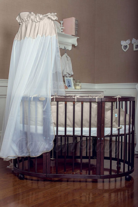 КРОВАТКА- ТРАНСФОРМЕР "COMFORT BABY" .Цена: 25 000 руб.  ХАРАКТЕРИСТИКИ:  возраст детей: 0-5 лет  габариты модели (Д х Ш х В): 1) колыбельки: 78*76*81 см  2) овальной кроватки: 128*76*81 cм  матрас приобретается отдельно.  максимальная нагрузка: 120 кг  Материал: изготавливается только из настоящего массива бука высшего сорта.  сборка: кровать в разобранном виде, простота сборки, инструкция по сборке на русском языке  продукция сертифицирована  производство: Россия  гарантия: 2 года   Дополнительные характеристики: 4 положения по высоте (расстояние положения дна от пола без колес: 1см, 12см, 37см, 57см; расстояние между отверстиями снизу-наверх: 12см, 15см, 20см.); 3 прутика - съемные.  КОНМПЛЕКТАЦИЯ:  1-я ступень - круглая кроватка  2-я ступень - овальная кроватка  3-я ступень - диванчик  4-я ступень - манеж  5-я и 6-я ступени - 2 кресла и столик  7-я ступень - пеленальный столик  ДОПОЛНИТЕЛЬНЫЕ ОПЦИИ:  Комплект постельный "Classic" +6950 руб.  Комплект постельный "Colorit" + 11990 руб.  Фирменный держатель для балдахина +790 руб.  Комплект цельных матрасов " Холкон"/ "Кокос" (круглый+овальный) +8490 руб  Маятник "ComfortBaby Pendulum" 2 в 1+6990 руб.
